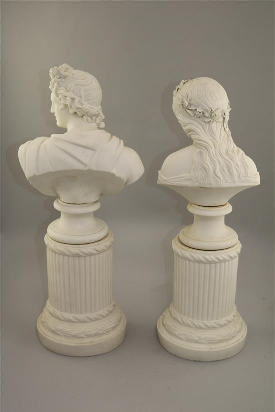 A pair of parian busts and columns, 19th century, 50cm and 48.5cm, slight losses to flowers